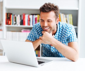 Casual man relaxing using laptop Stock Photo 01