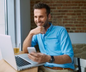 Casual man relaxing using laptop Stock Photo 05