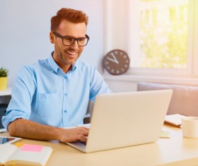 Casual man relaxing using laptop Stock Photo 06
