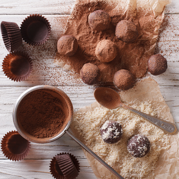 Chocolate truffle and chocolate powder on the desktop Stock Photo 02