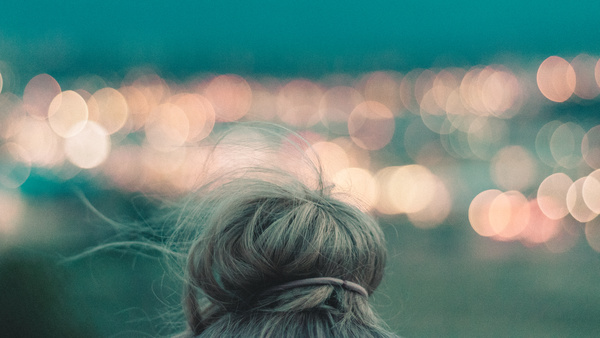 Closeup of woman hairstyle and bokeh lights Stock Photo