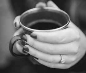 Closeup woman holding tea cup Stock Photo