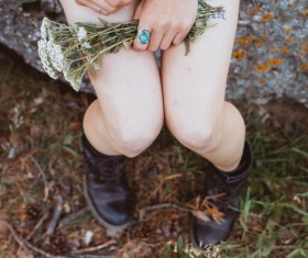 Closeup woman holding wild flowers Stock Photo