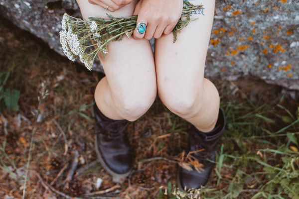 Closeup woman holding wild flowers Stock Photo