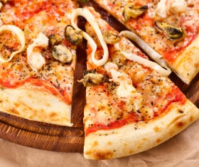 Cut apart seafood pizza Stock Photo