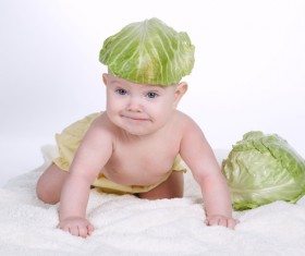 Cute baby and vegetables Stock Photo