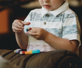 Cute little boy playing with toys Stock Photo