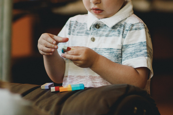 Cute little boy playing with toys Stock Photo