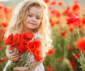 Cute little girl holding flowers Stock Photo