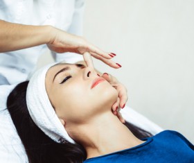 Facial massage and maintenance Stock Photo