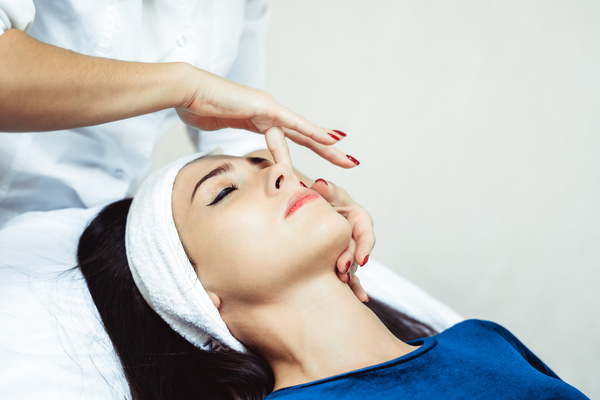 Facial massage and maintenance Stock Photo