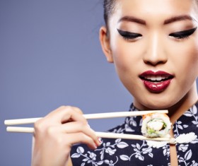 Girl eating Japanese sushi Stock Photo 01