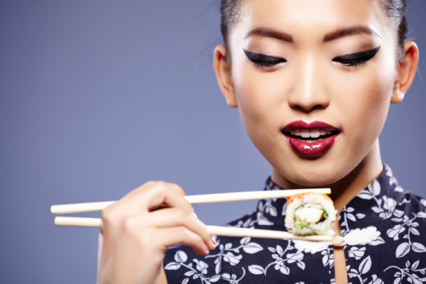 Girl eating Japanese sushi Stock Photo 01