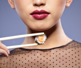 Girl eating Japanese sushi Stock Photo 02