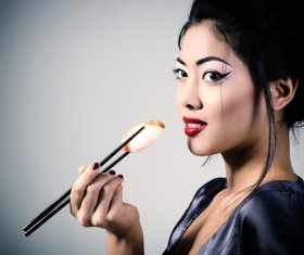 Girl eating Japanese sushi Stock Photo 03