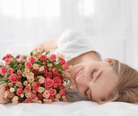 Girl in bed holding rose flower in bed Stock Photo 05