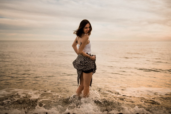 Girl standing in the sea Stock Photo