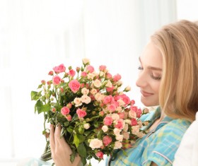 Happy girl holding a bouquet of roses Stock Photo 01