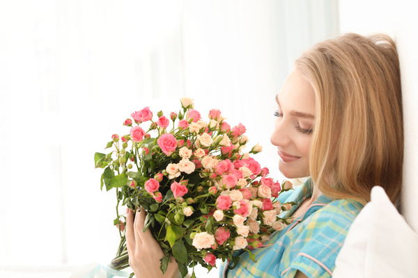 Happy girl holding a bouquet of roses Stock Photo 01