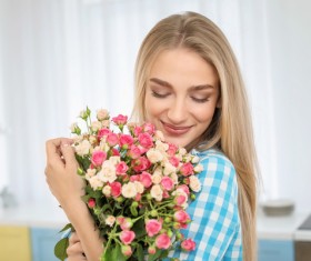 Happy girl holding a bouquet of roses Stock Photo 02