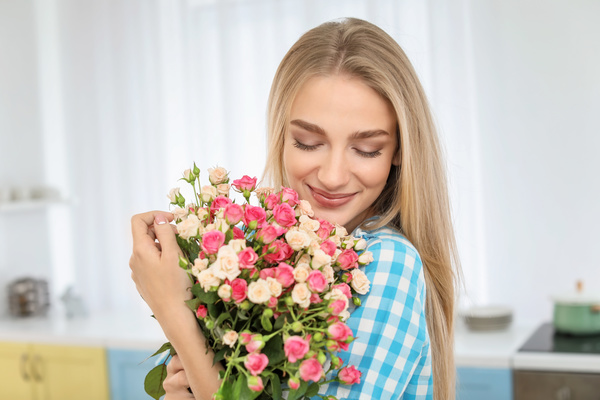 Happy girl holding a bouquet of roses Stock Photo 02
