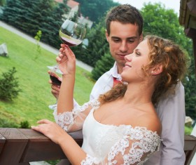 Happy wedding couple drinking wine Stock Photo