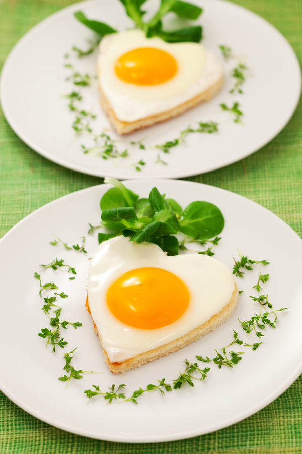 Heart-shaped fried egg and bread breakfast Stock Photo 01