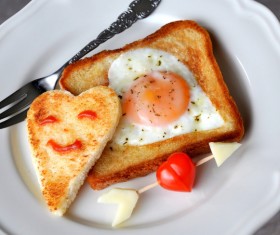 Heart-shaped fried egg and bread breakfast Stock Photo 02