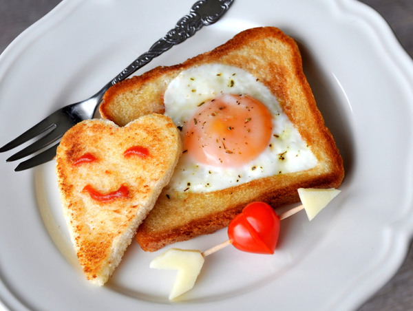 Heart-shaped fried egg and bread breakfast Stock Photo 02
