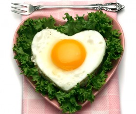 Heart-shaped fried egg and bread breakfast Stock Photo 03
