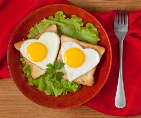 Heart-shaped fried egg and bread breakfast Stock Photo 04