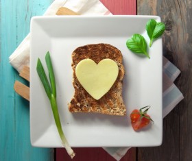 Heart-shaped fried egg and bread breakfast Stock Photo 05