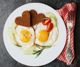 Heart-shaped fried egg and bread breakfast Stock Photo 07