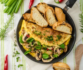 Home cooking mushrooms omelet and slice of bread Stock Photo