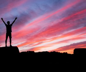 In the sunset open arms man Stock Photo