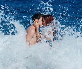 Intimate couple in the seawater Stock Photo