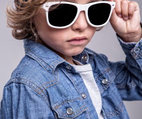 Little boy wearing sunglasses Stock Photo
