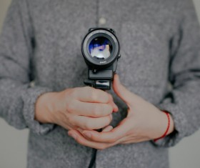 Man holding camera Stock Photo