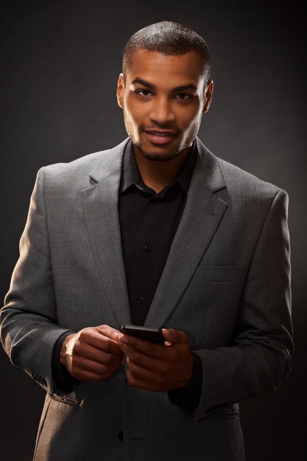Man holding smart phone Stock Photo