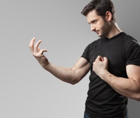 Man looking at his arm Stock Photo