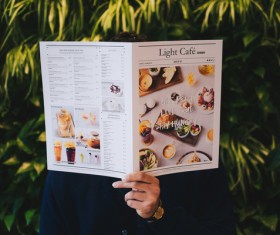 Man looking menu Stock Photo