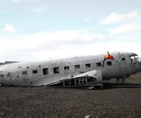 Man playing on crashed plane Stock Photo