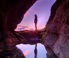 Man posing on natural rocky cave landscape Stock Photo
