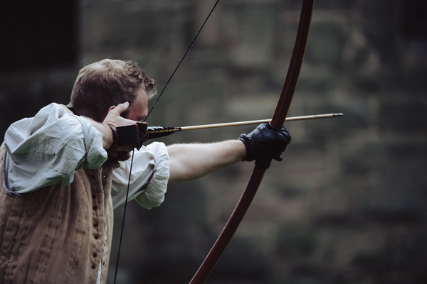 Man practising arrow bow Stock Photo