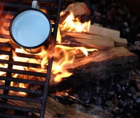On the bonfire boil the cup of water Stock Photo