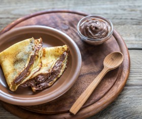 Pancakes and chocolate sauce Stock Photo