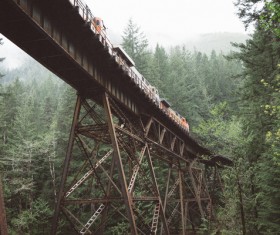 Railway on steel bridge in forest Stock Photo