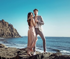 Seaside posing young couple taking pictures Stock Photo 05