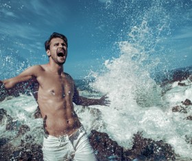 Seaside posing young man Stock Photo