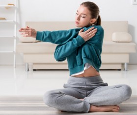 Slim girl practicing yoga indoors Stock Photo 01